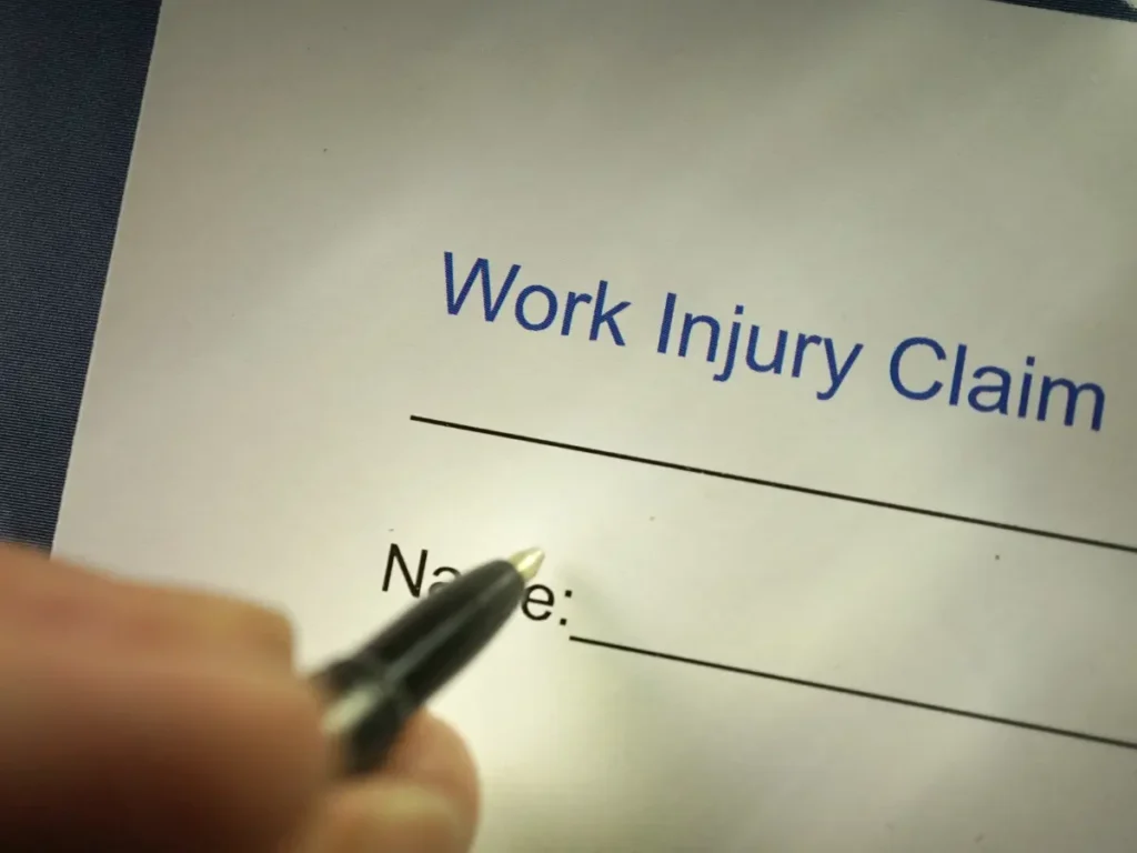 person filling out a workers comp claim